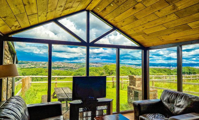 Horseshoe Cottage lounge with views over farmland and Swansea